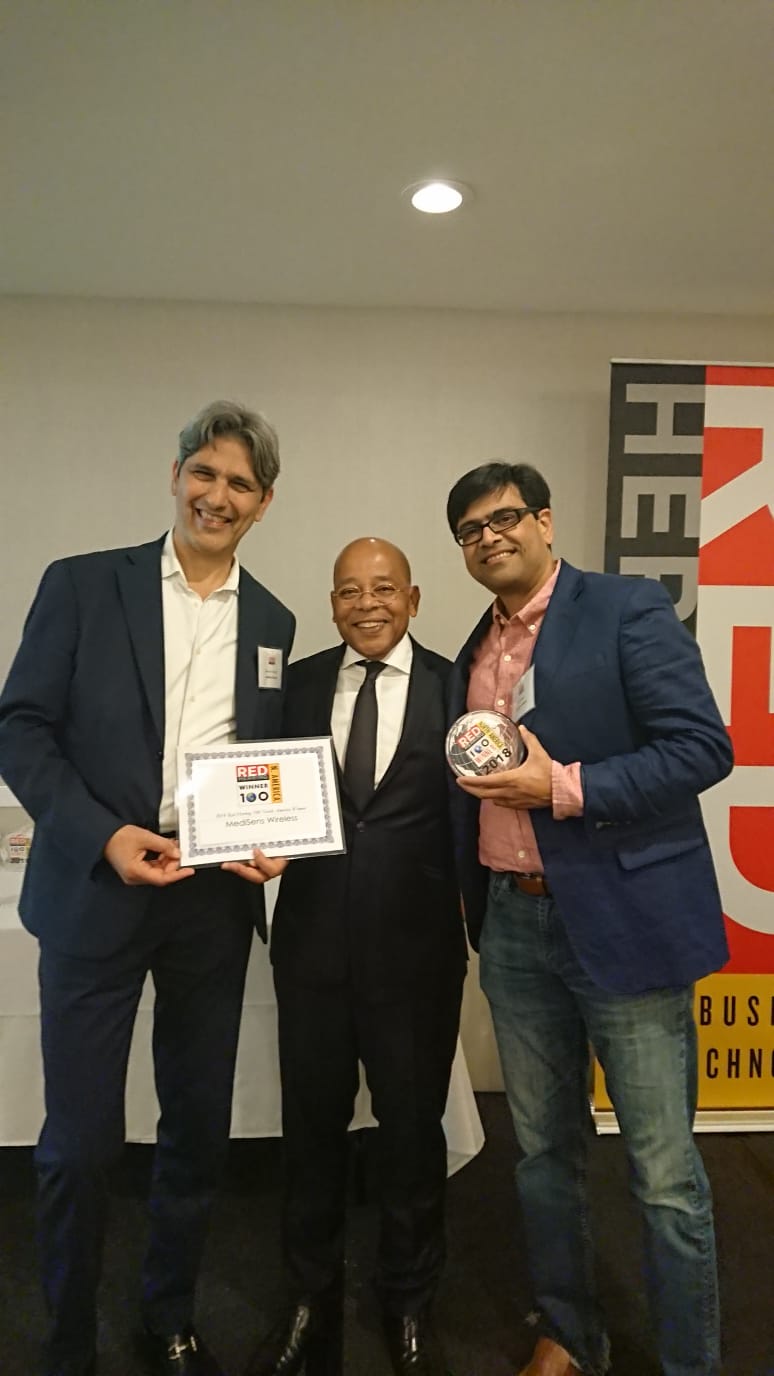 Picture of the MediSens team receiving the award from the CEO of Red Herring. From left to right, Behrooz Yadegar, MediSens' CEO, Alex Vieux, CEO of Red Herring, and Nitin Raut, MediSens' CTO/VP Eng. 